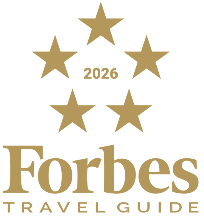 The golden stars and title of Forbes Five Star 2026 accreditation from Forbes Travel Guide
