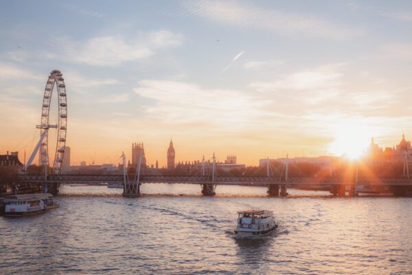 Crafted by Akatoki cover image, sunrise over London bridge with the Millenium Wheel and Big Ben visible in the background, a boat moving along the river, and a crisp, early morning skyline.