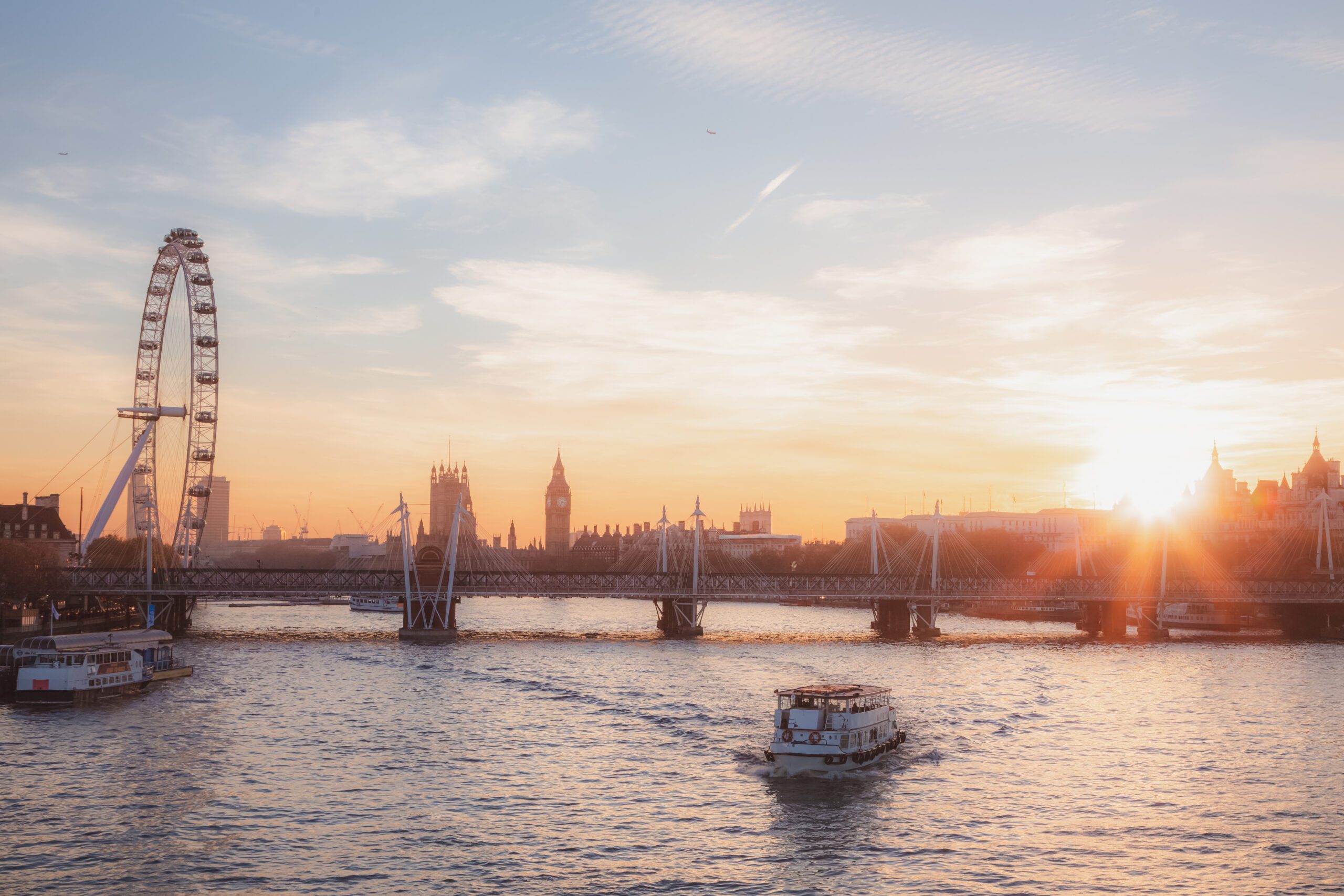 Crafted by Akatoki cover image, sunrise over London bridge with the Millenium Wheel and Big Ben visible in the background, a boat moving along the river, and a crisp, early morning skyline.