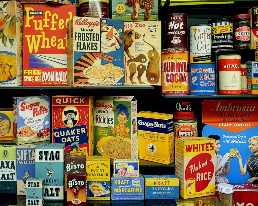 Historic product packaging and vintage brand advertisements displayed chronologically