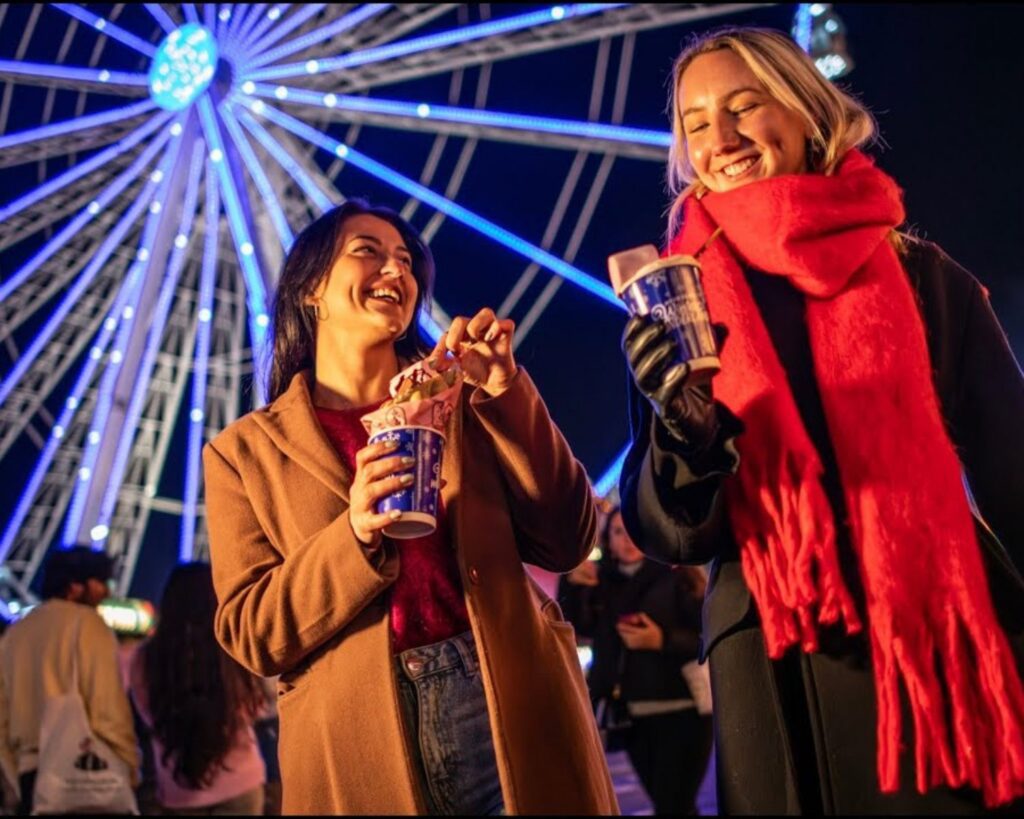 Visitors enjoying Winter Wonderland while staying at The Prince Akatoki London near Hyde Park.