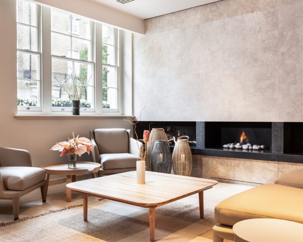 The Sanctuary, an oasis of calm inside The Prince Akatoki luxury hotel near Marylebone London, where guests can sit by the fireplace