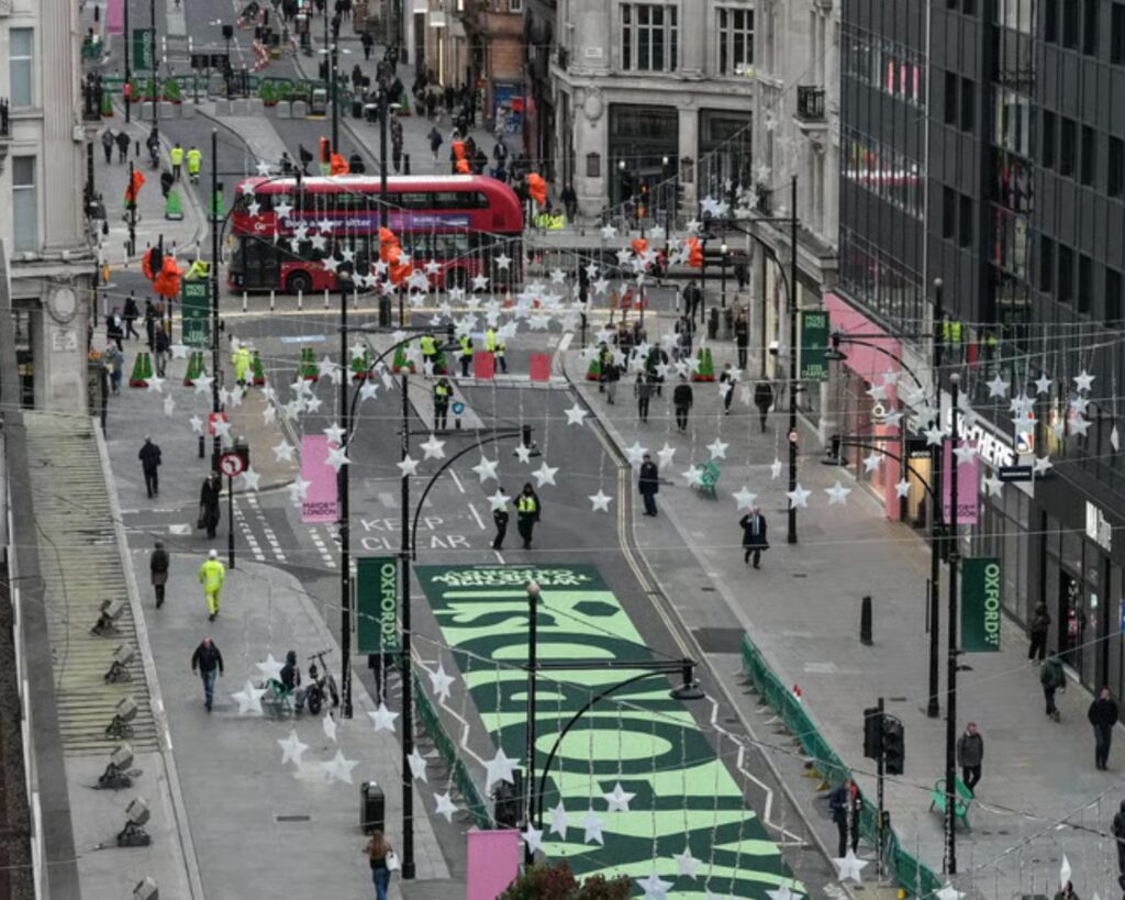 The newly pedestrianised Oxford Street from above, showing people walking in the road that used to have cars on it.